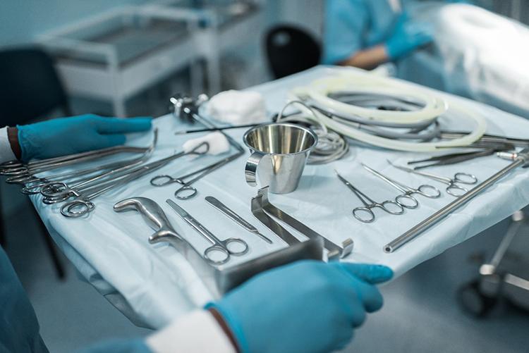 Image of surgical tools on a stainless steel tray